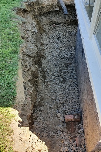 Trench for pipe repairs dug out