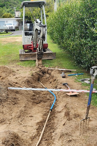 Trench for pipe repairs dug out